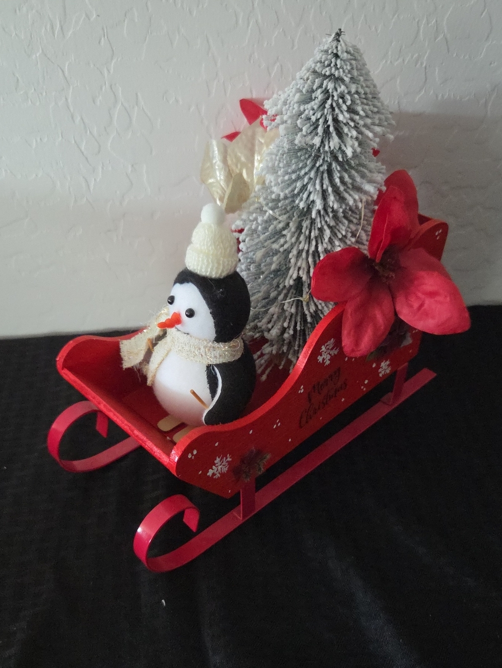 Festive Red Sleigh Holiday Tabletop Decor with Penguin and Tree
